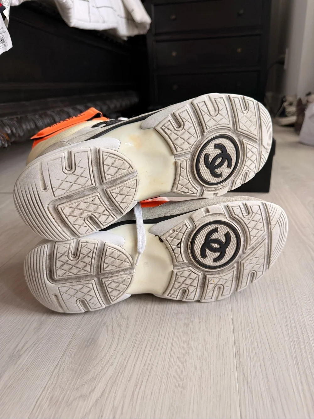 CHANEL Orange and Black High-Top Sneaker
